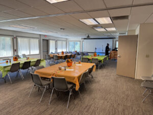An event room with four big tables is ready to host Memory Cafe participants.