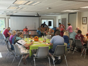 A fall-themed Memory Cafe is well-attended.