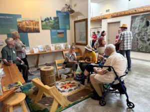 A candid shot of a group of people in a foyer area at a library.