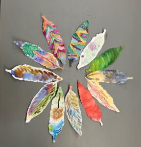 A circle of painted paper features.