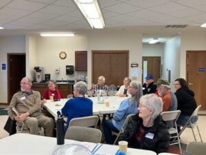 A shot of Memory Cafe participants sitting around a table.