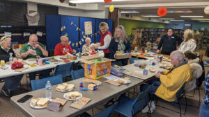 Memory Cafe participants each lunch while attending a memory cafe at a library
