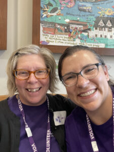 Two workers at the Library Memory Project take a selfie together.
