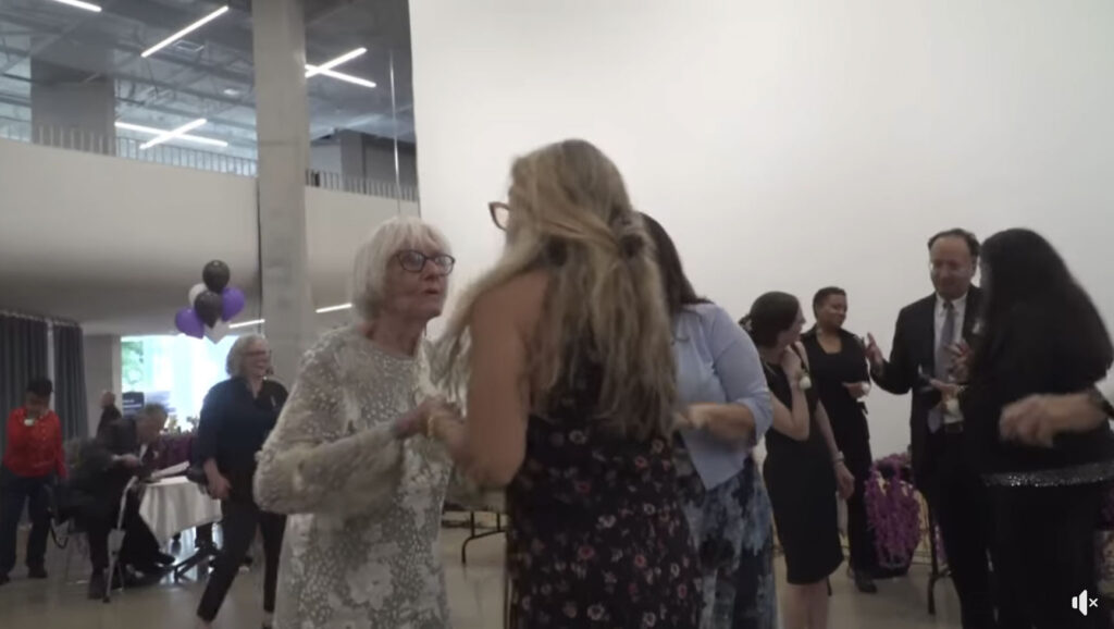 Elderly people dancing and socializing