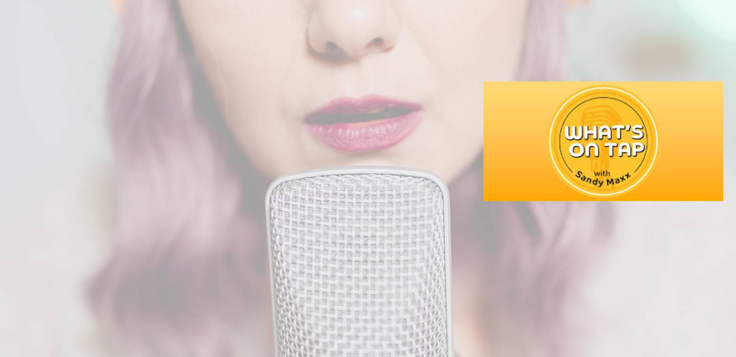 Woman speaking very closely to microphone with a What's on Tap graphic